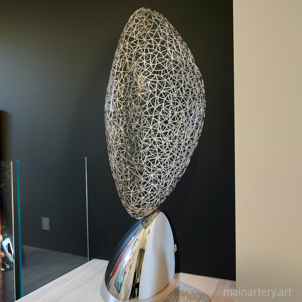 Cover: Oval-Inspired Woven Stainless Steel Sculptures