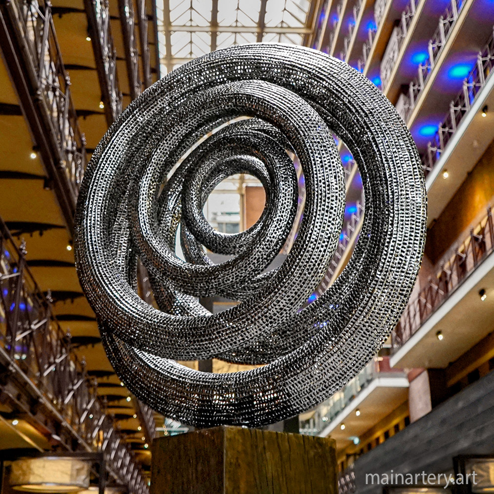 Cover: Six Endless Cycle Stainless Steel Sculptures