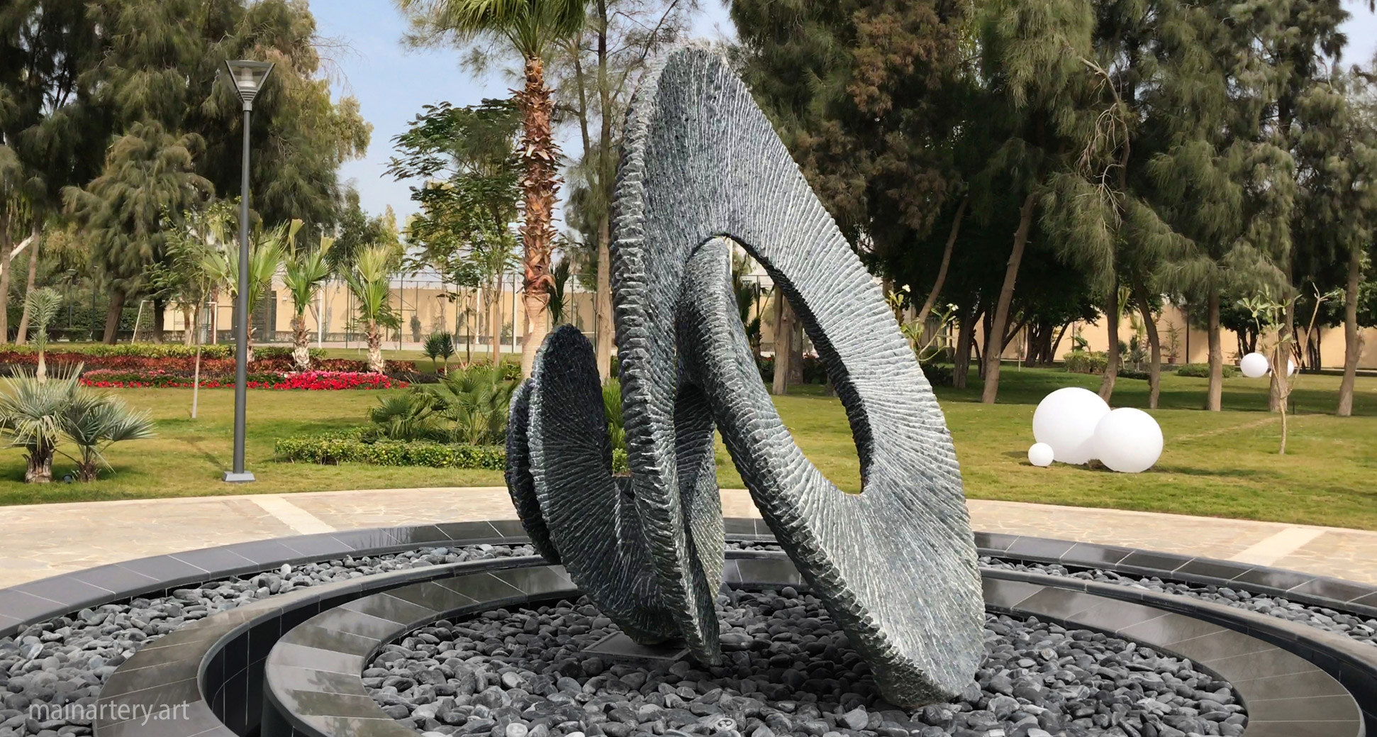 giant stone organic public art sculpture image