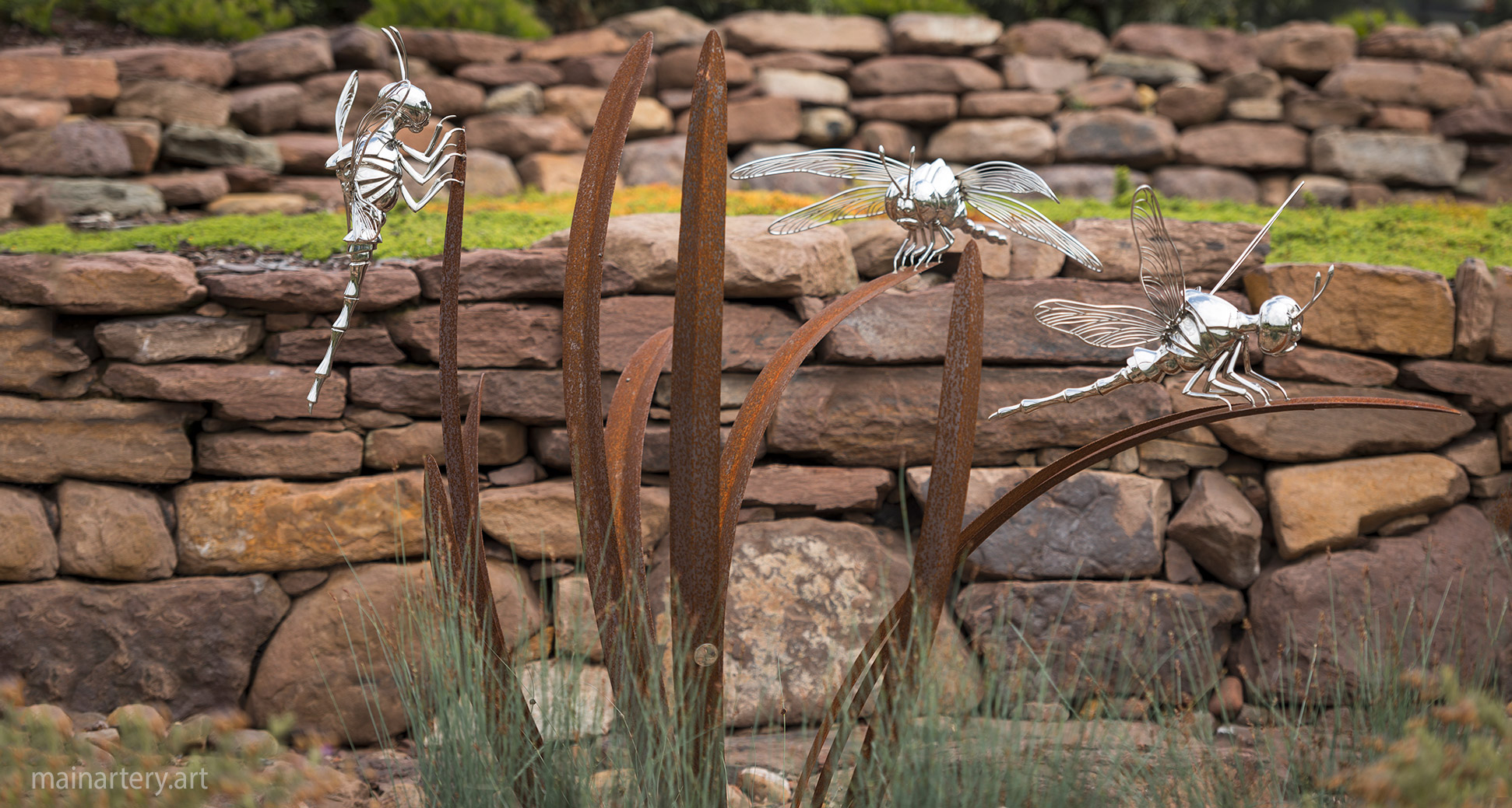 large courtyard sculpture dragonfly congregation image