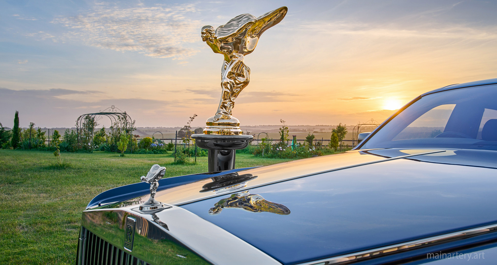 polished bronze rolls royce sculpture image