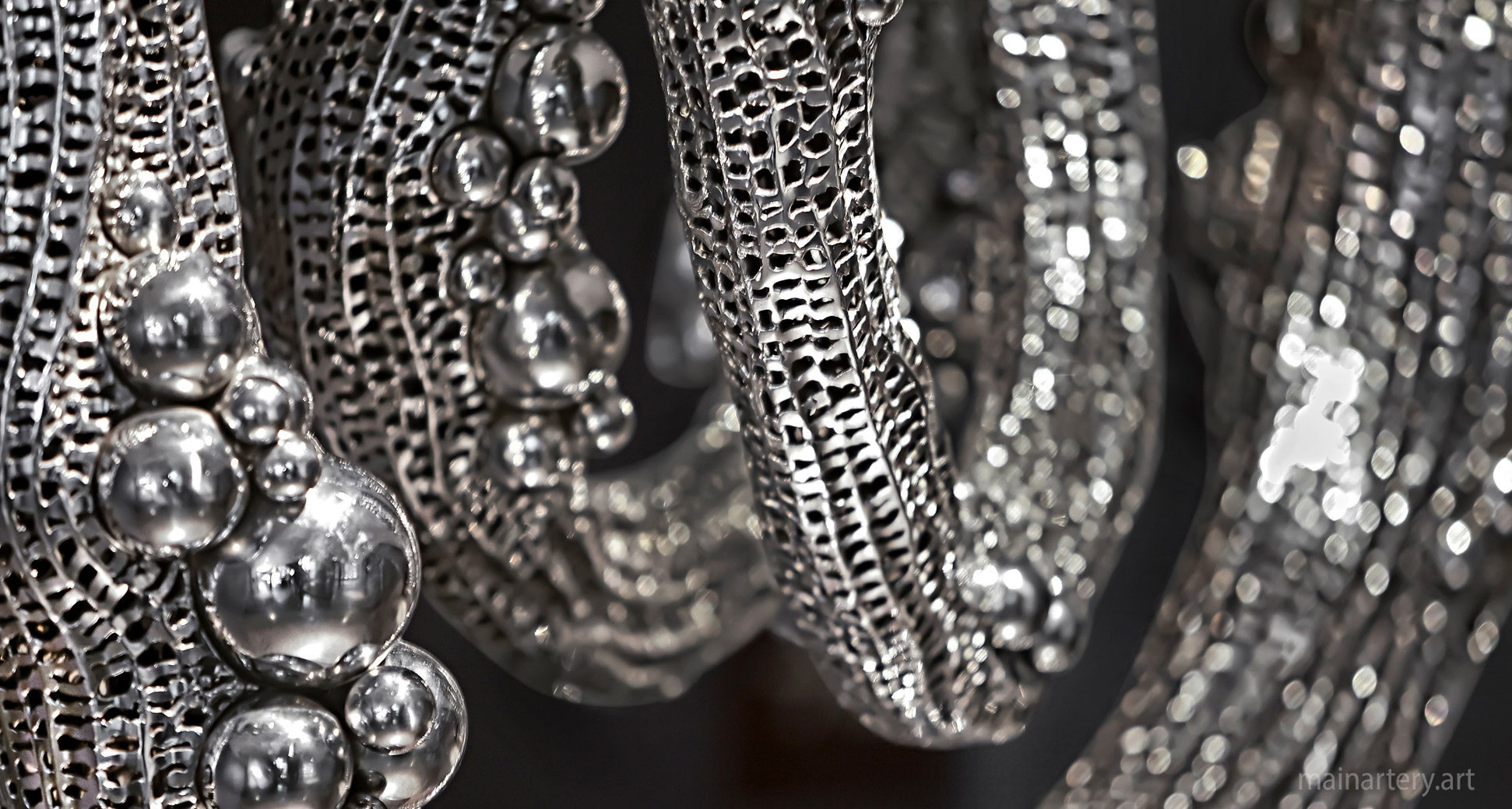 polished stainless modern galaxy wall sculpture image