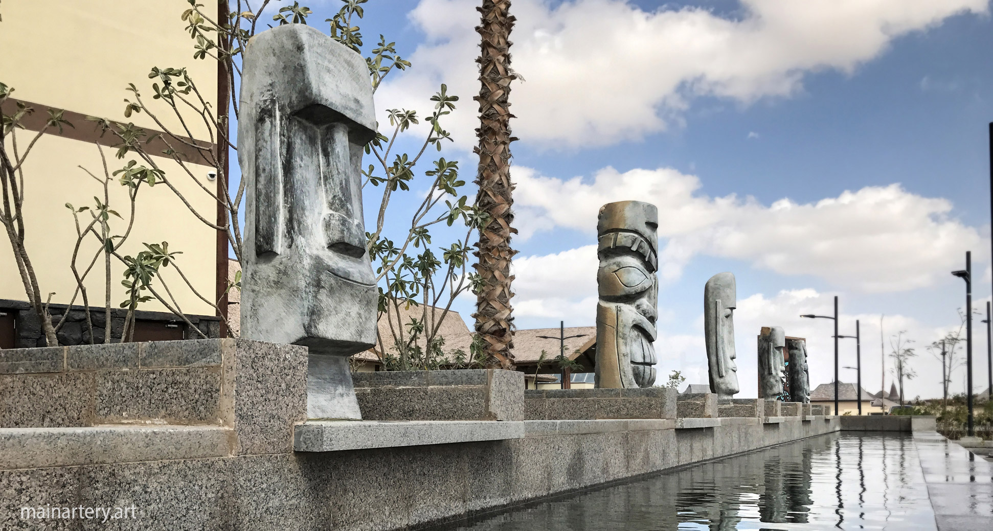 tiki themed stone representational totem art image