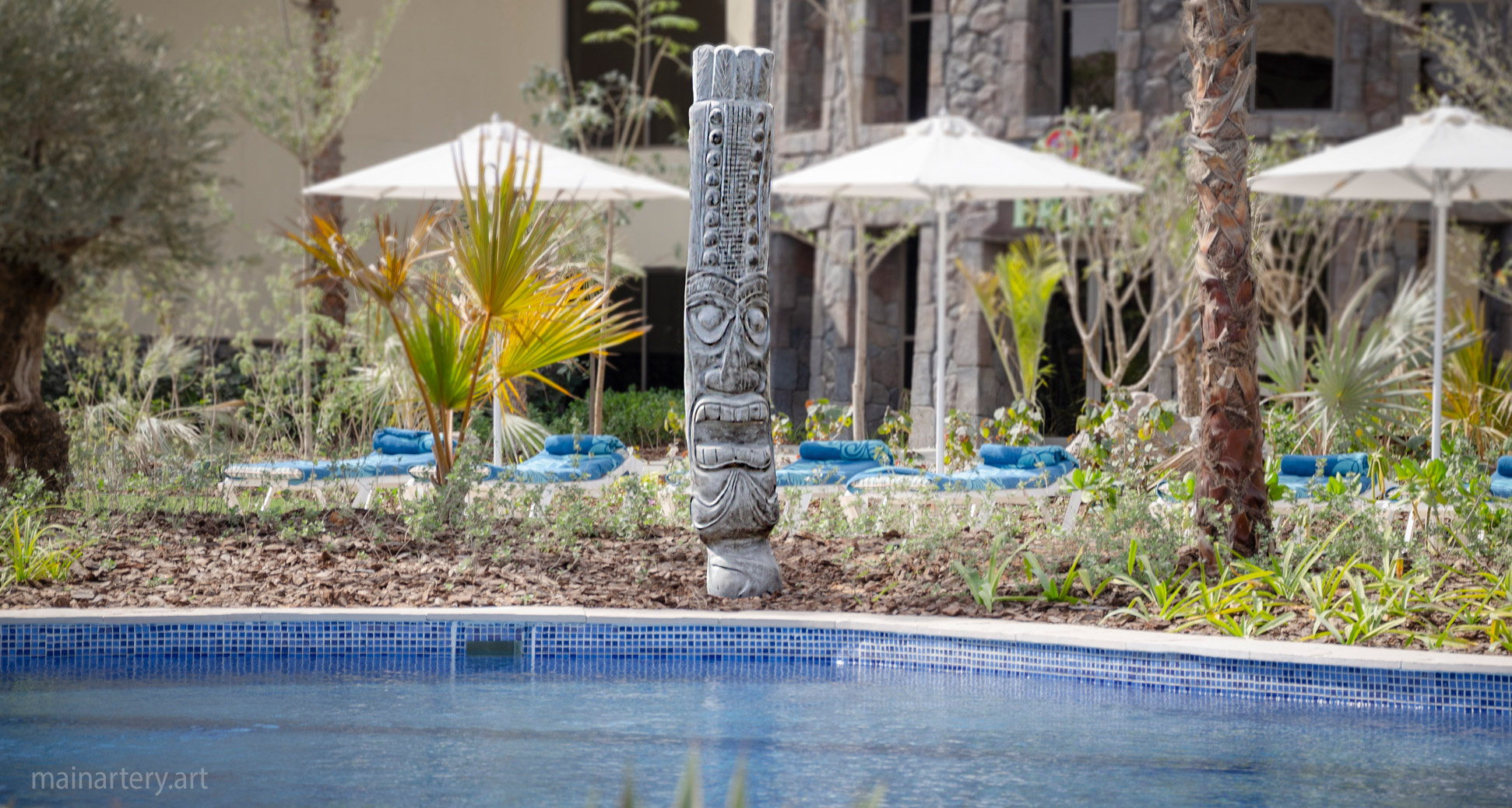 tiki themed stone contemporary outdoor art image