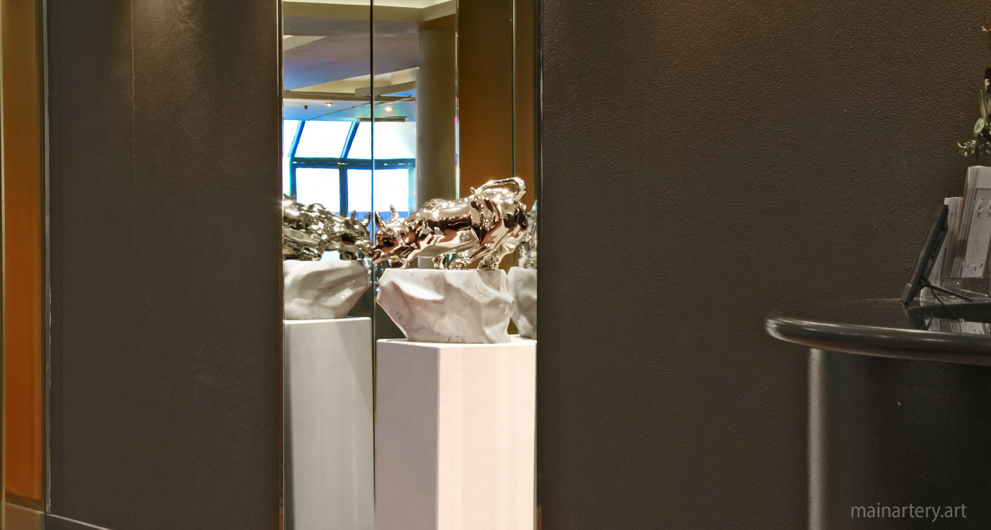 metal bull interior sculpture mirror image