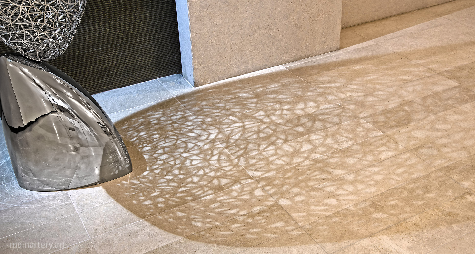 large stainless steel intricate shadows sculpture image