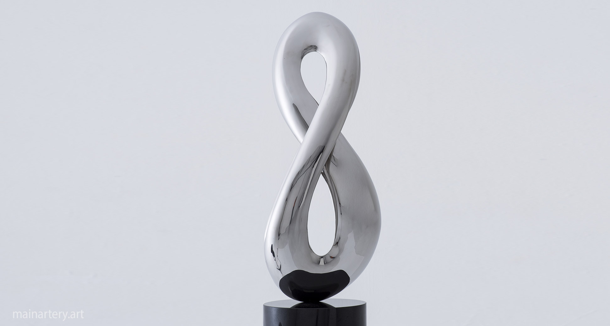 polished infinity feng shui sculpture image