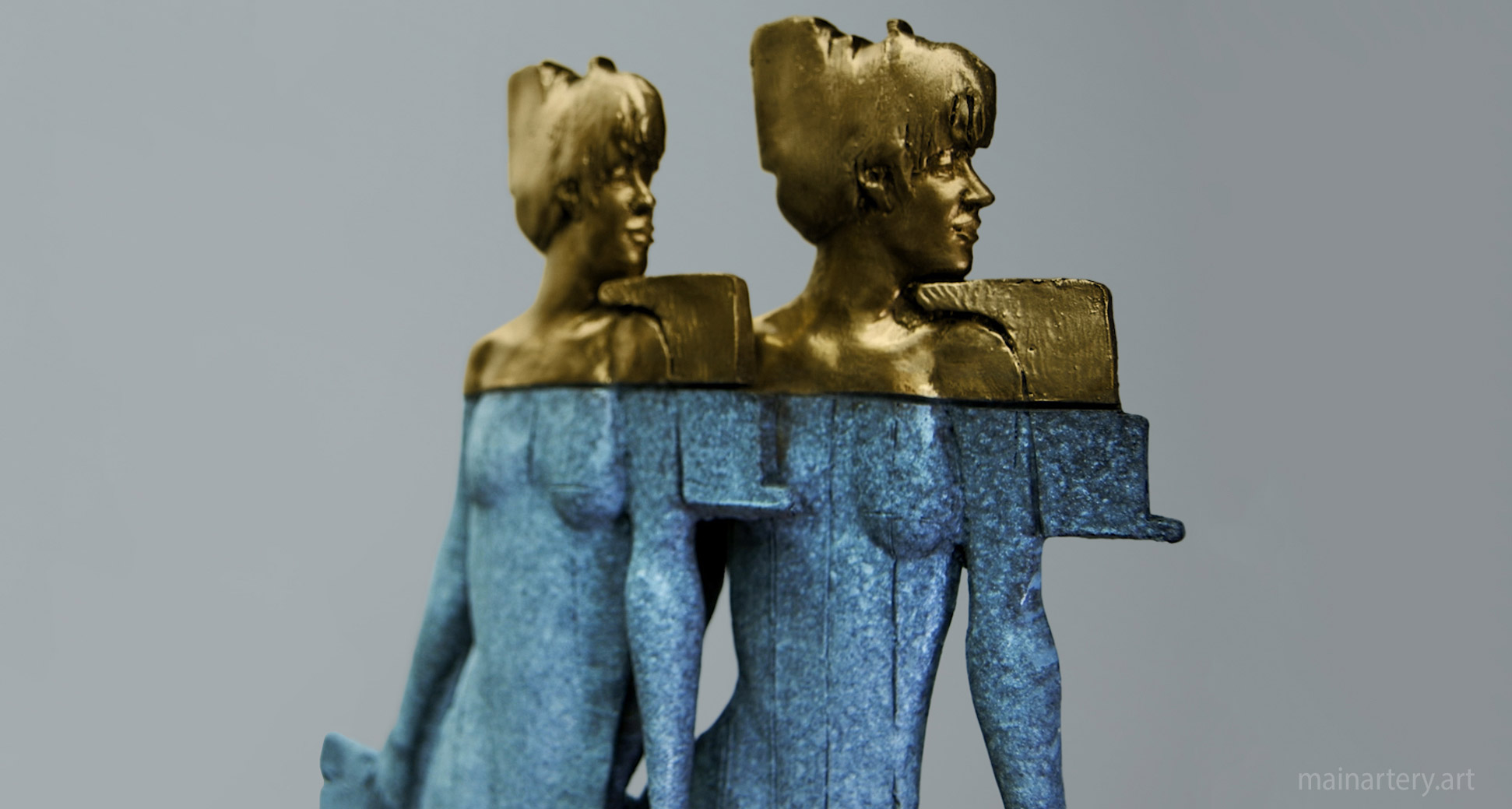 small retro styled bronze sculpture twin girls image