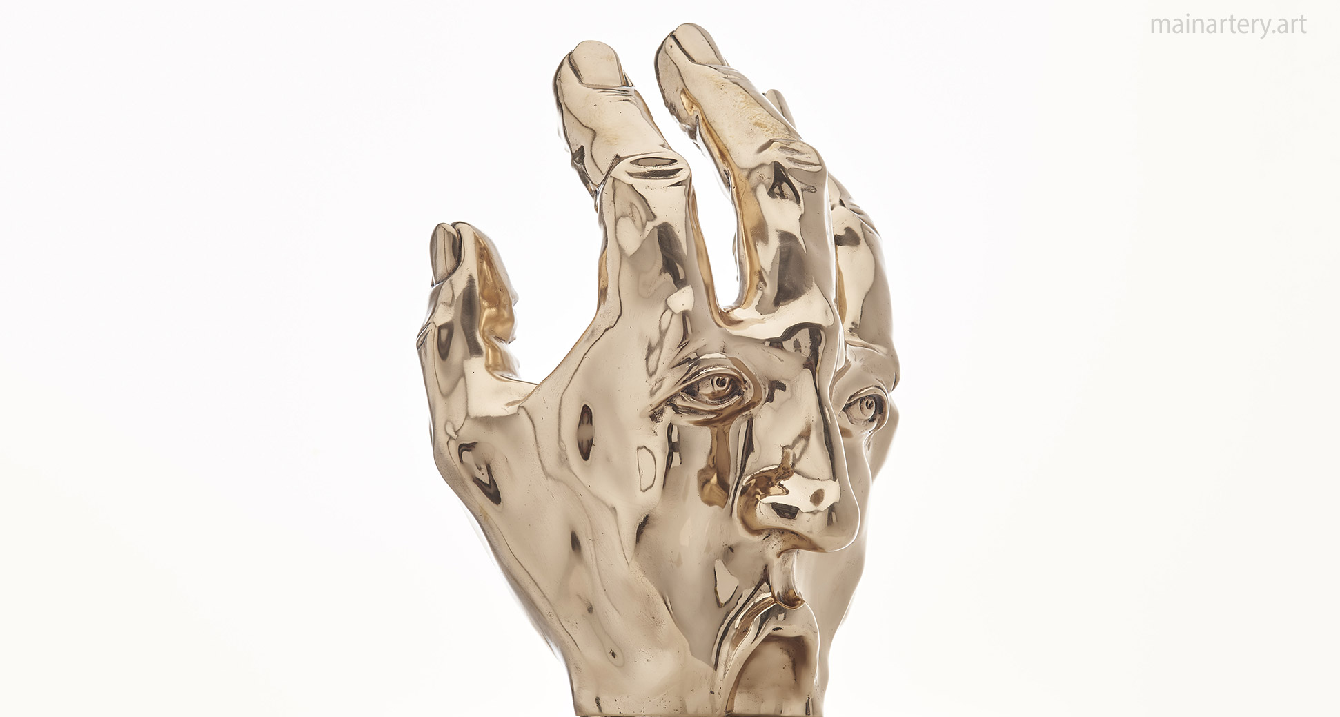 interior polished bronze hand artwork image