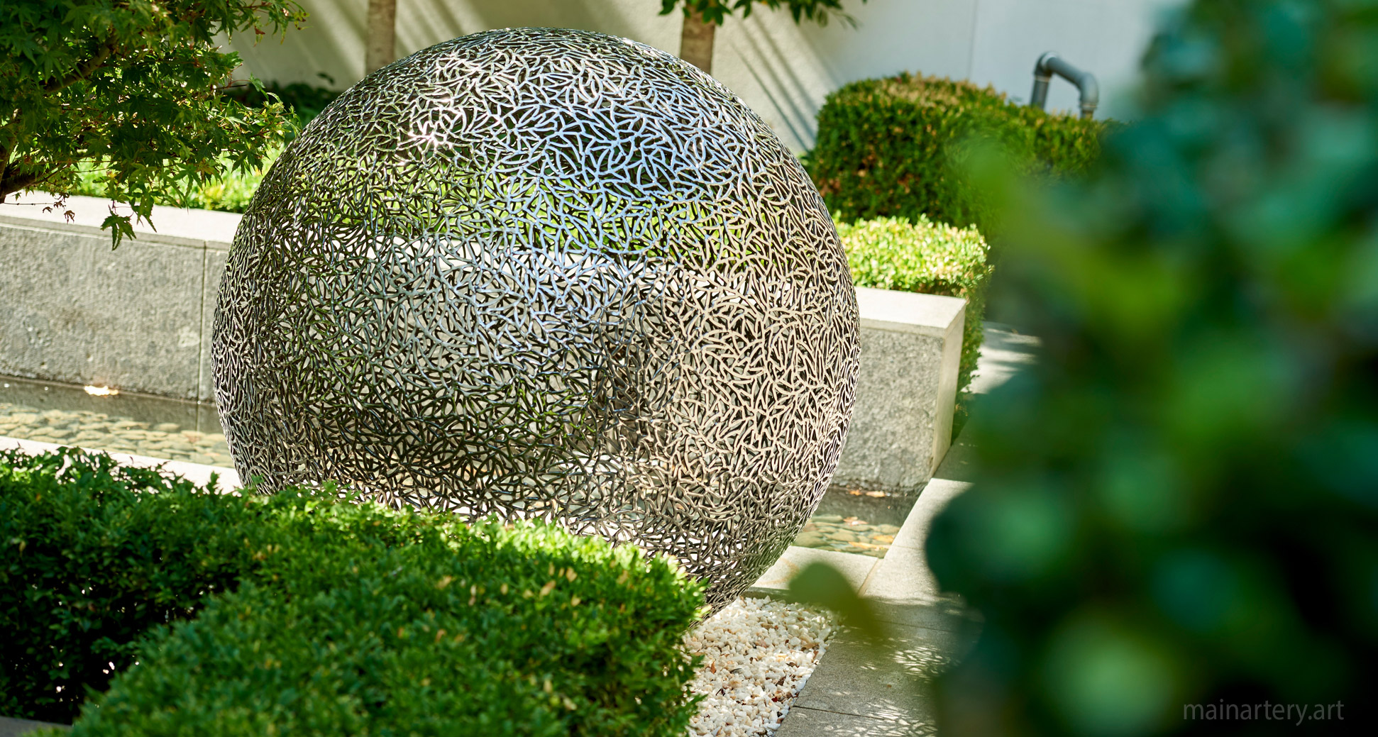 large polished organic sphere garden sculpture image