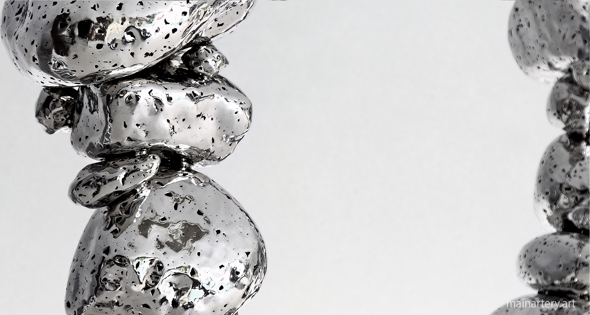 metal stones contemporary abstract polished stainless sculpture image