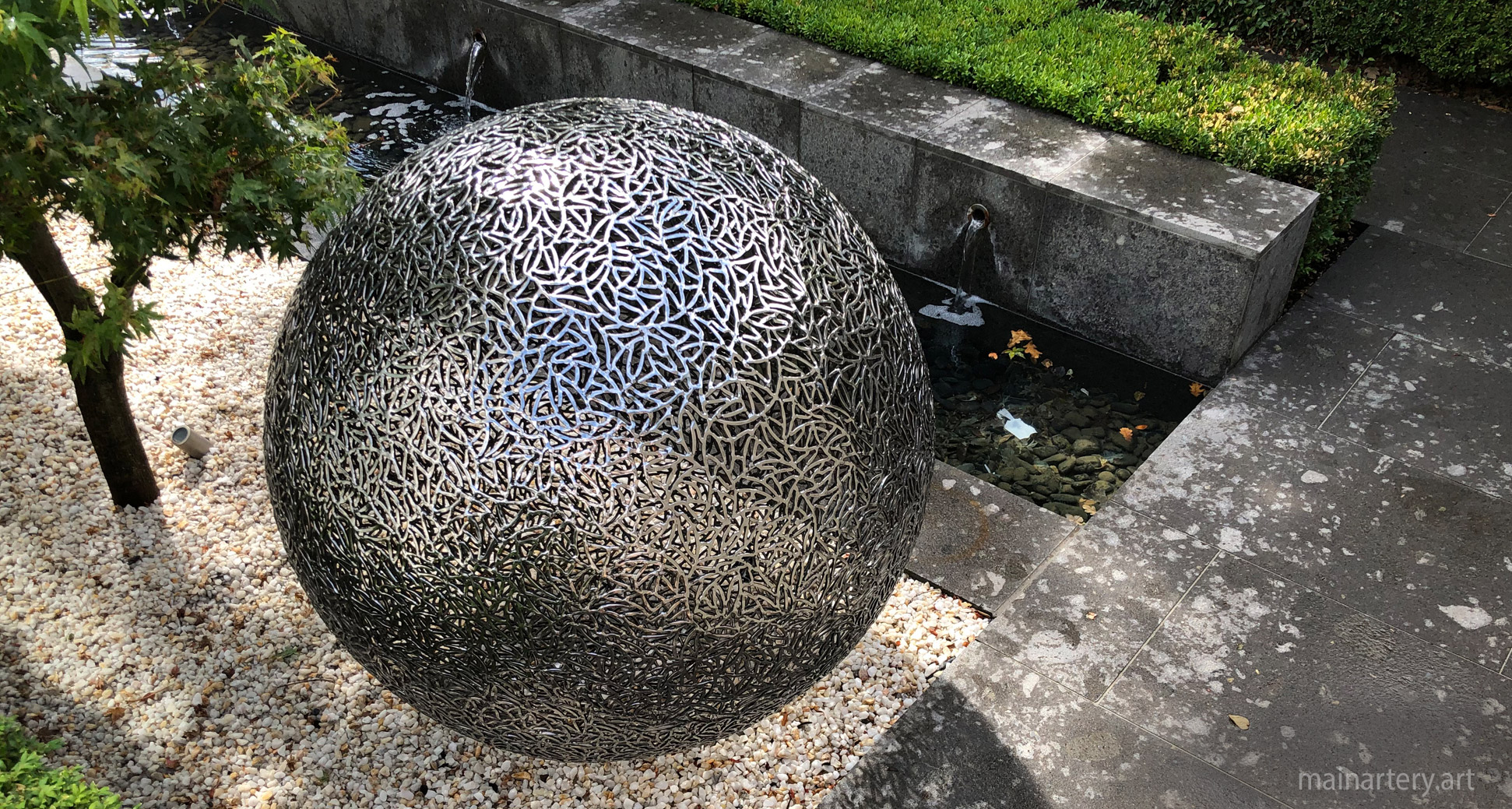 freestanding metal spherical detailed sculpture image
