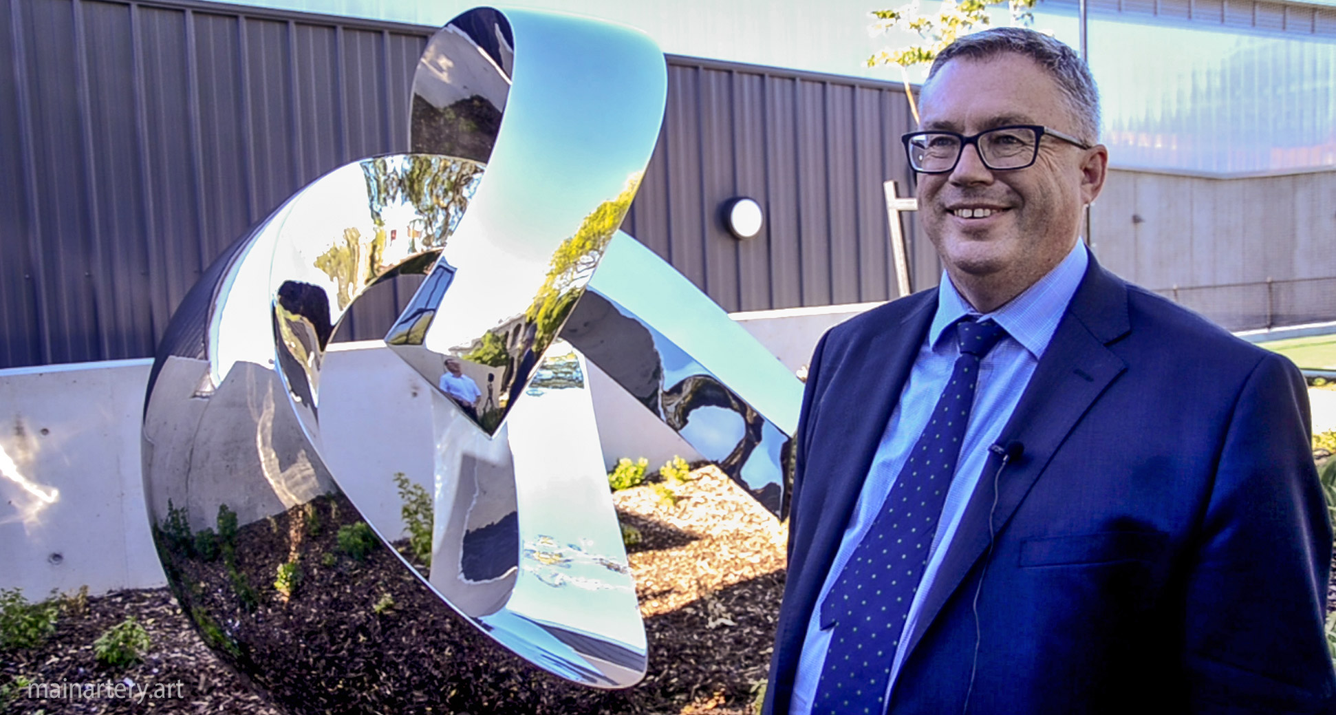 giant polished contemporary school sculpture happy principal image