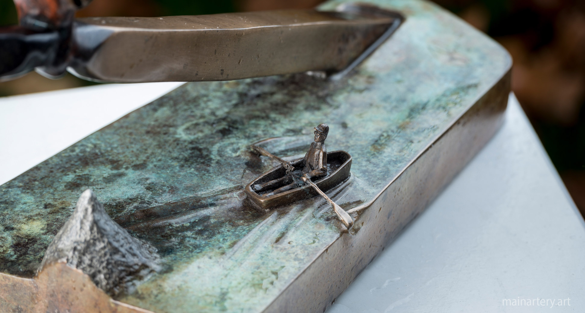 patina contemporary boatman rowing sculpture image