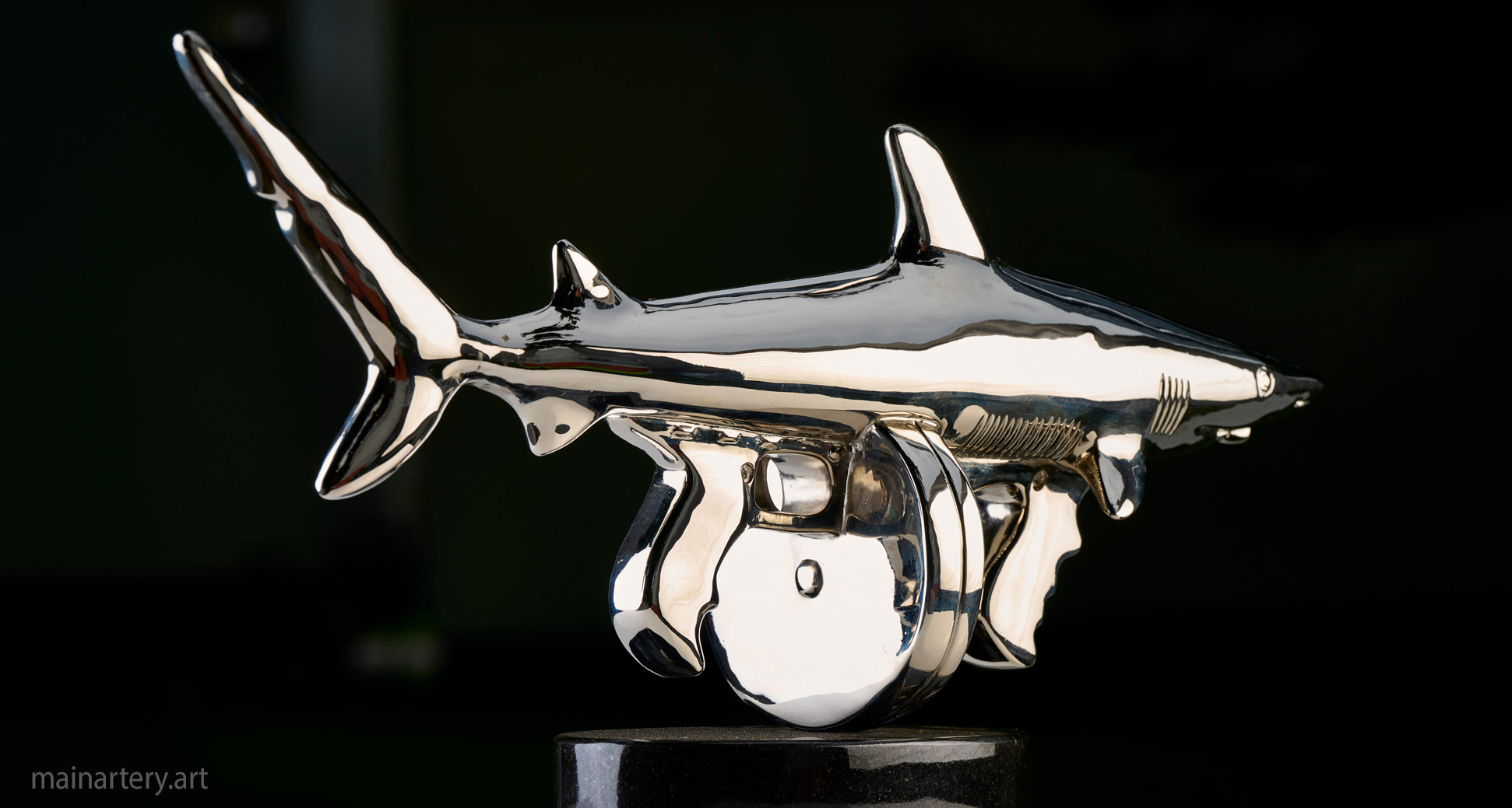 interior mirror polished representational shark sculpture image