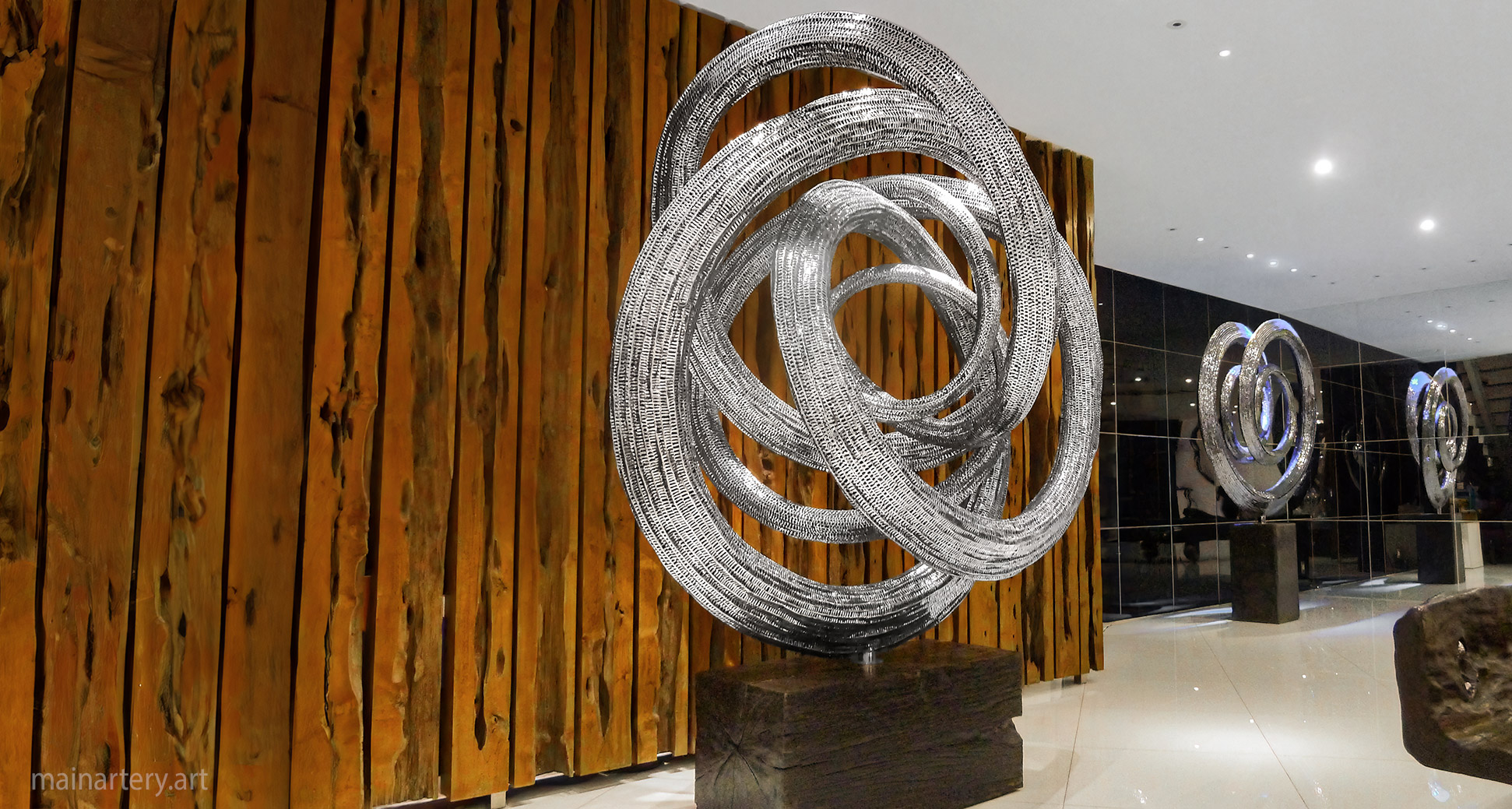 large freestanding designer nucleus cyclic infinity sculpture image