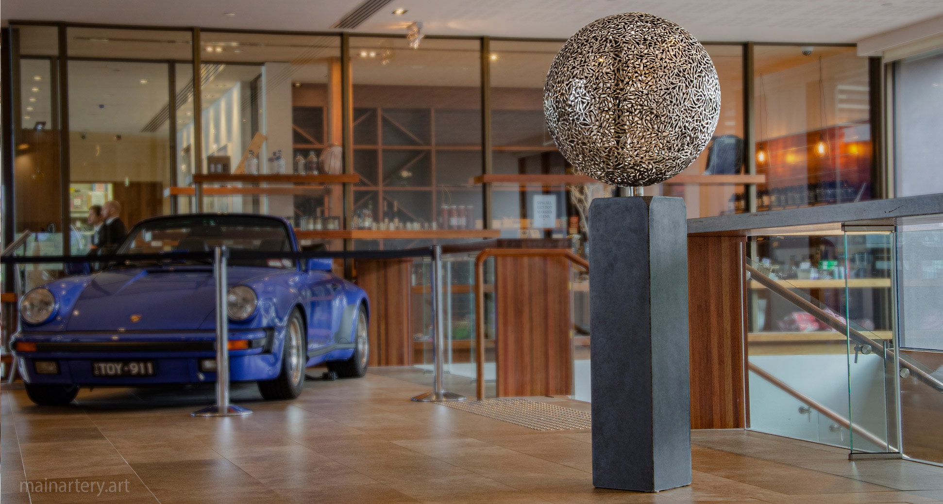 polished freestanding spherical interior sculpture image