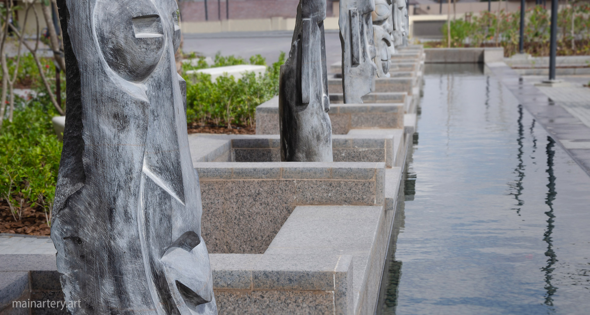 hand carved stone figurative garden art image