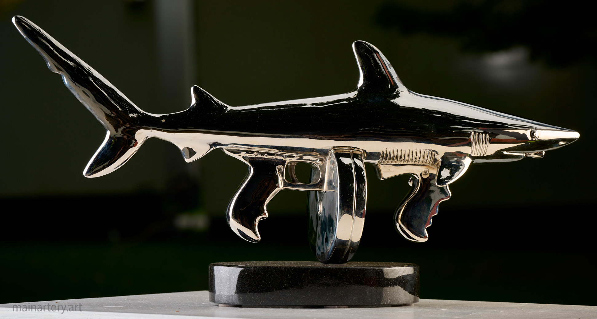 small metal from natures hand shark gun artwork image