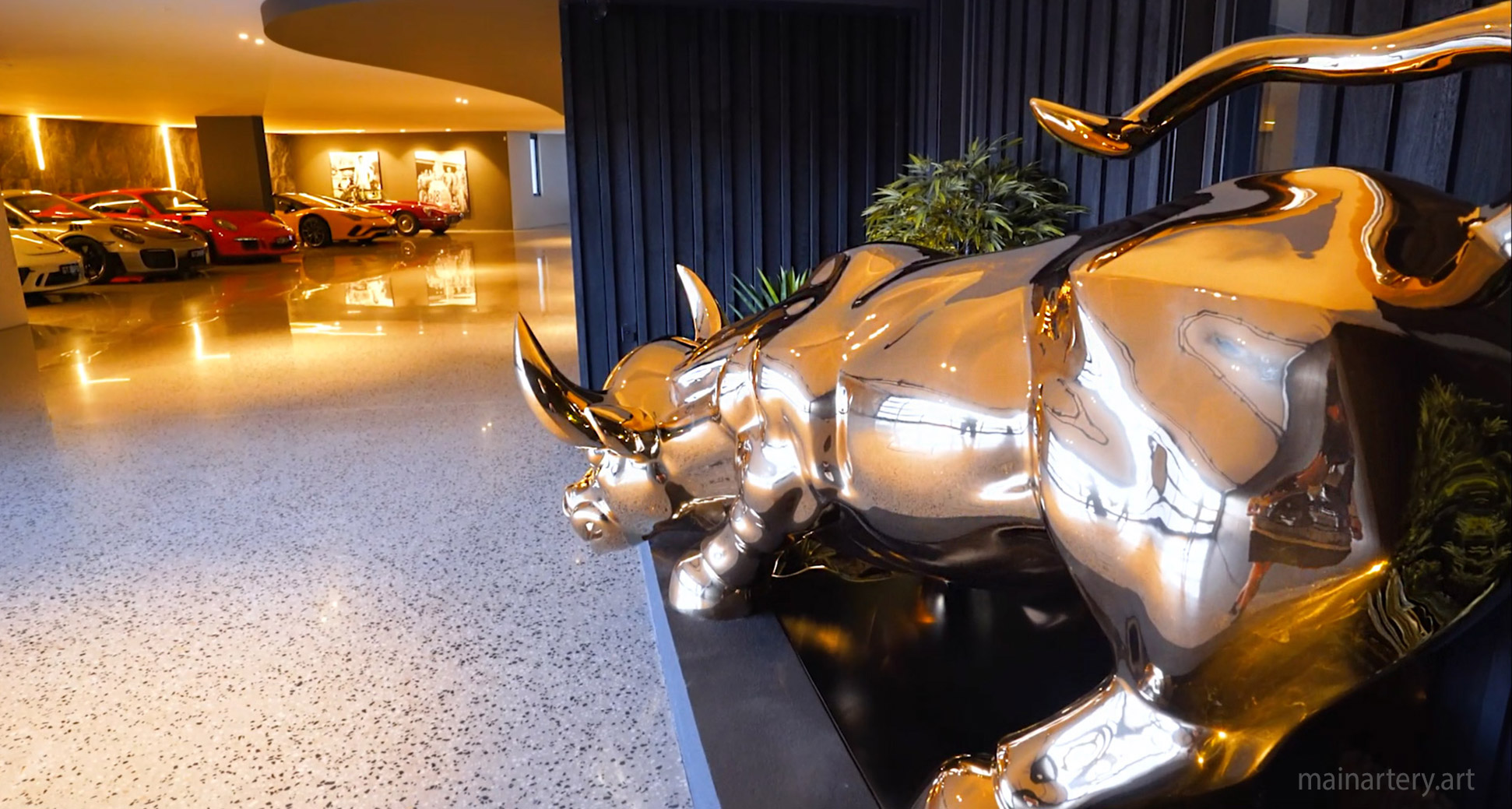 large mirror polished charging bull luxury garage sculpture image