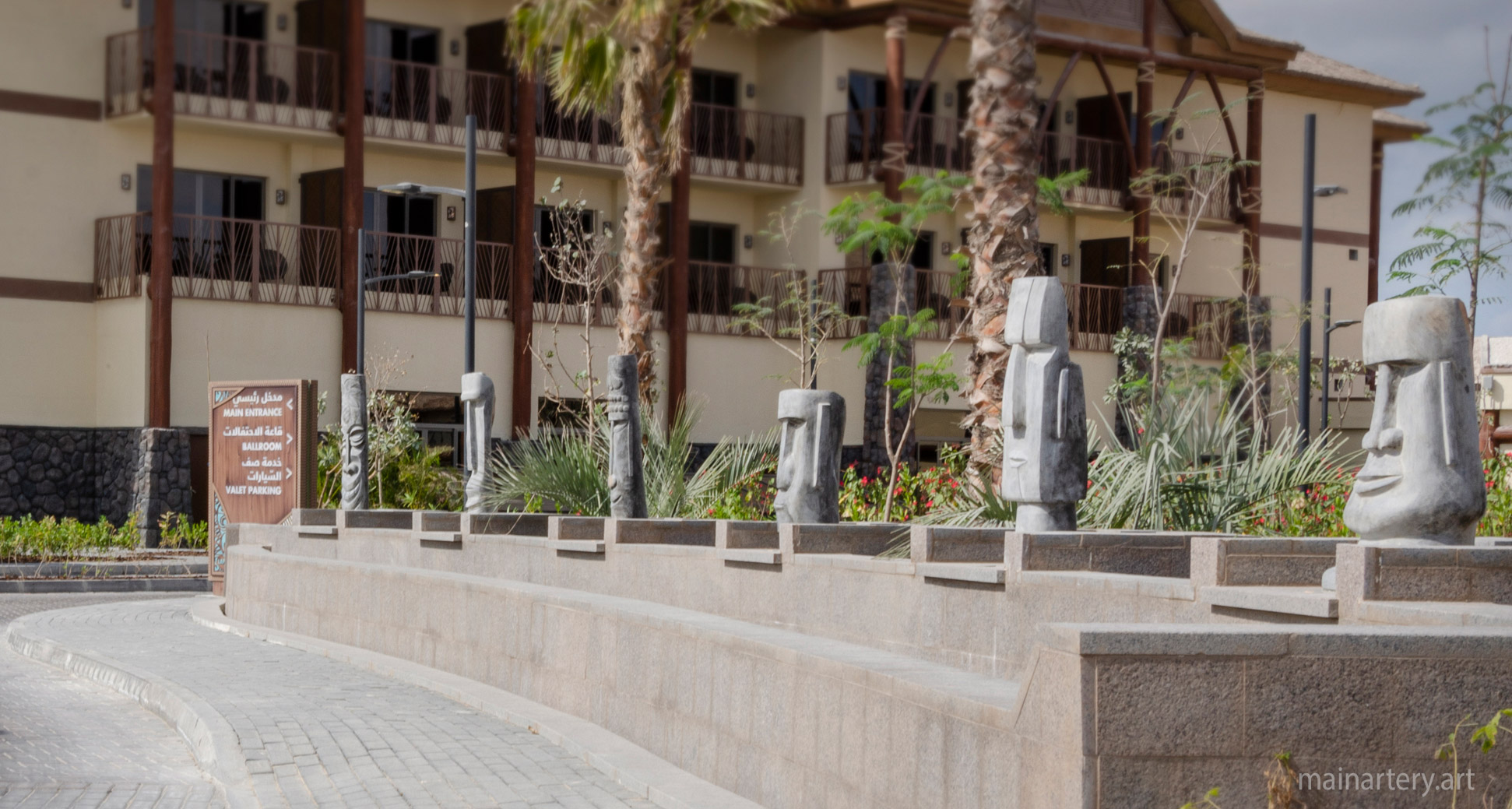polynesian themed stone representational outdoor sculpture image