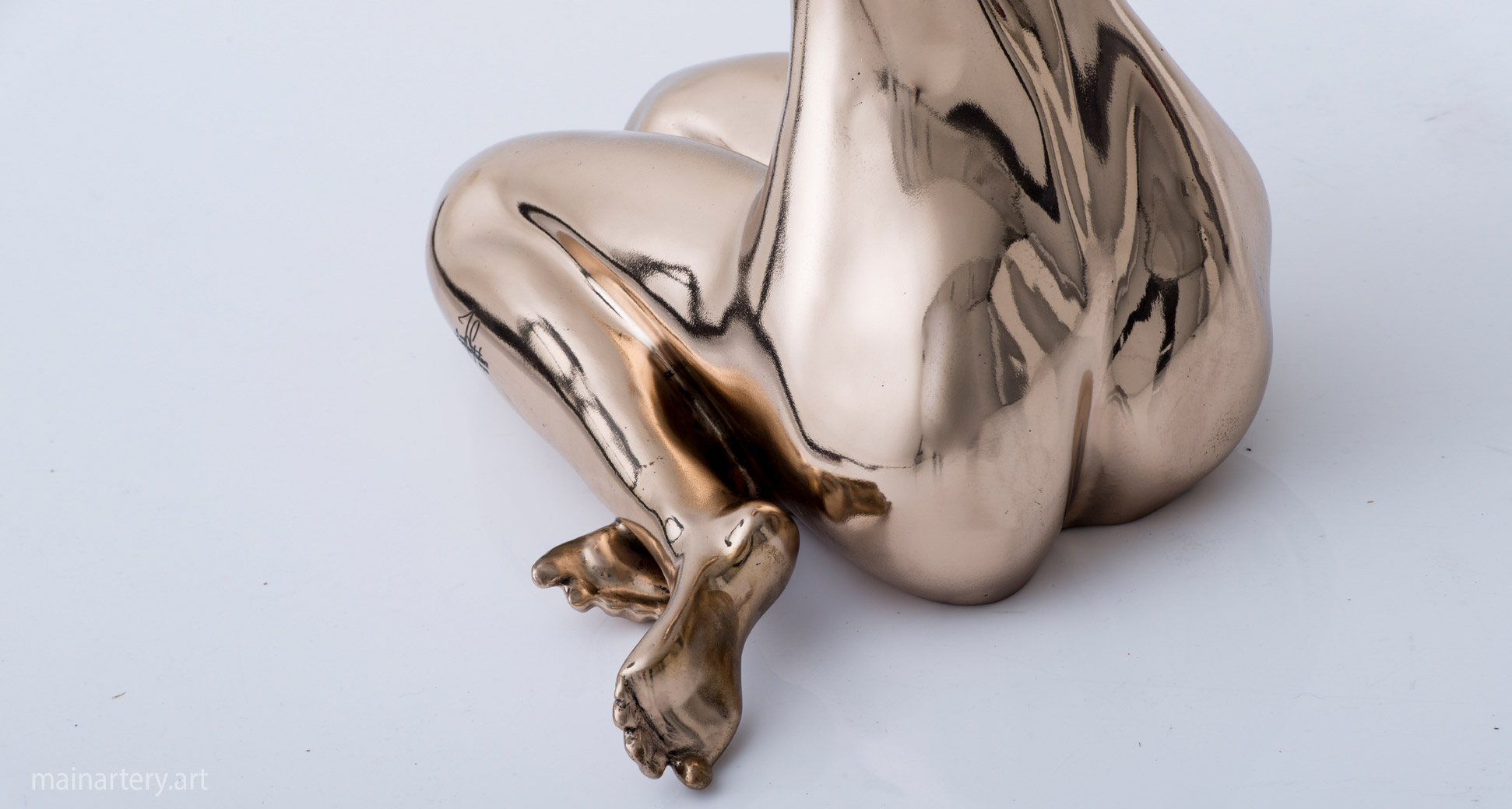 small polished bronze modern sculpture image