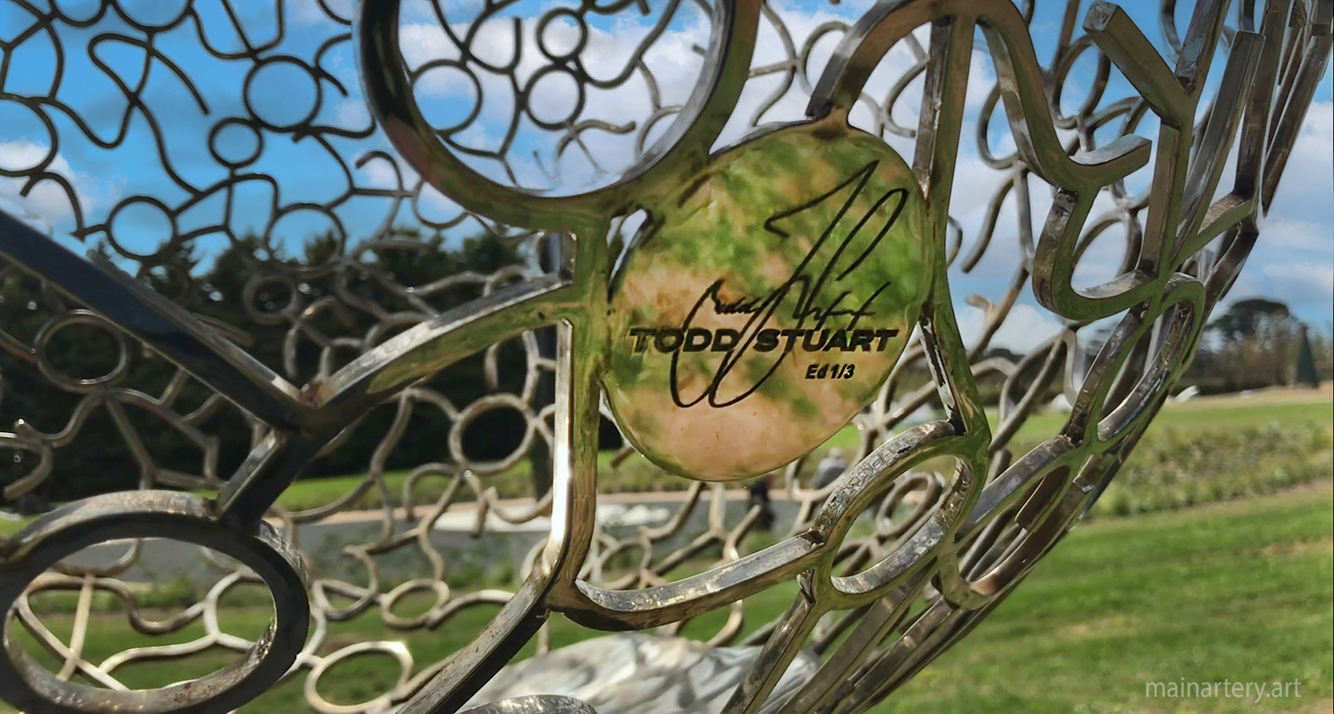 stick figures polished stainless steel sculpture detail image