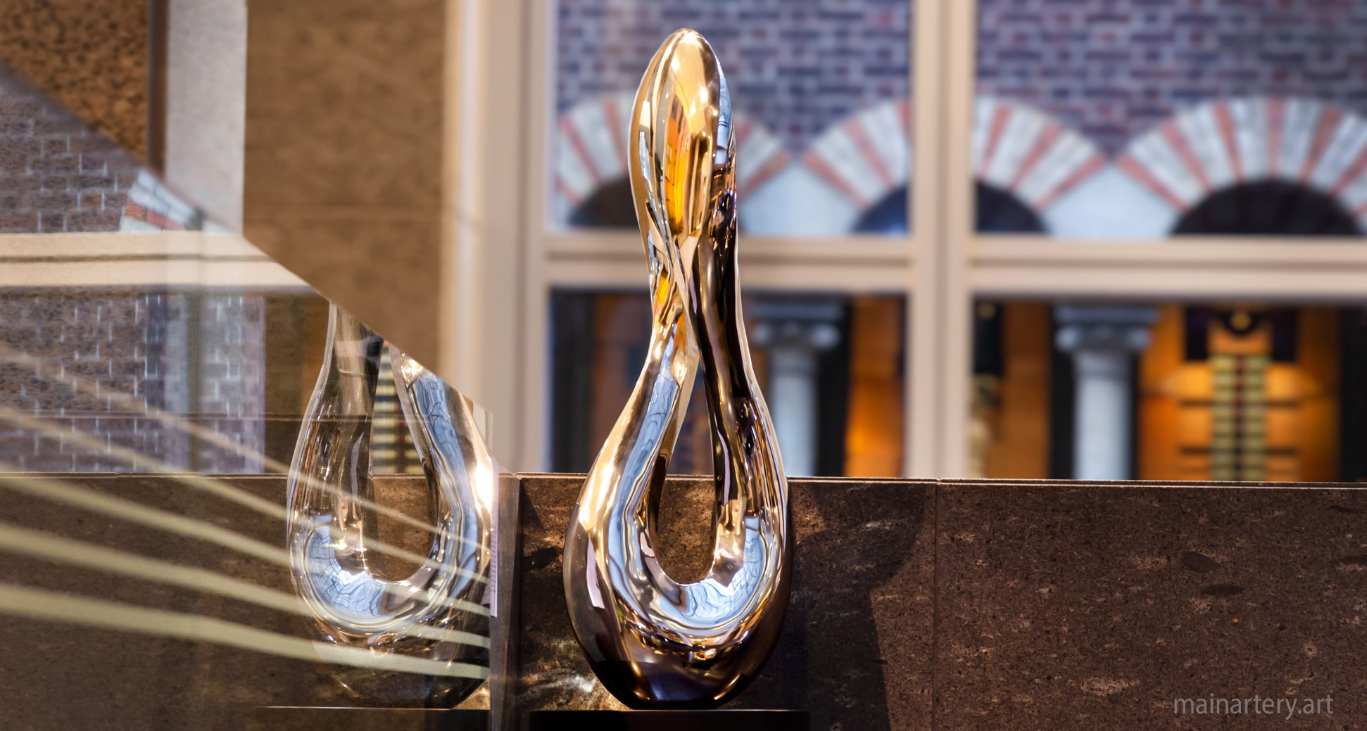 freestanding polished contemporary infinity art image